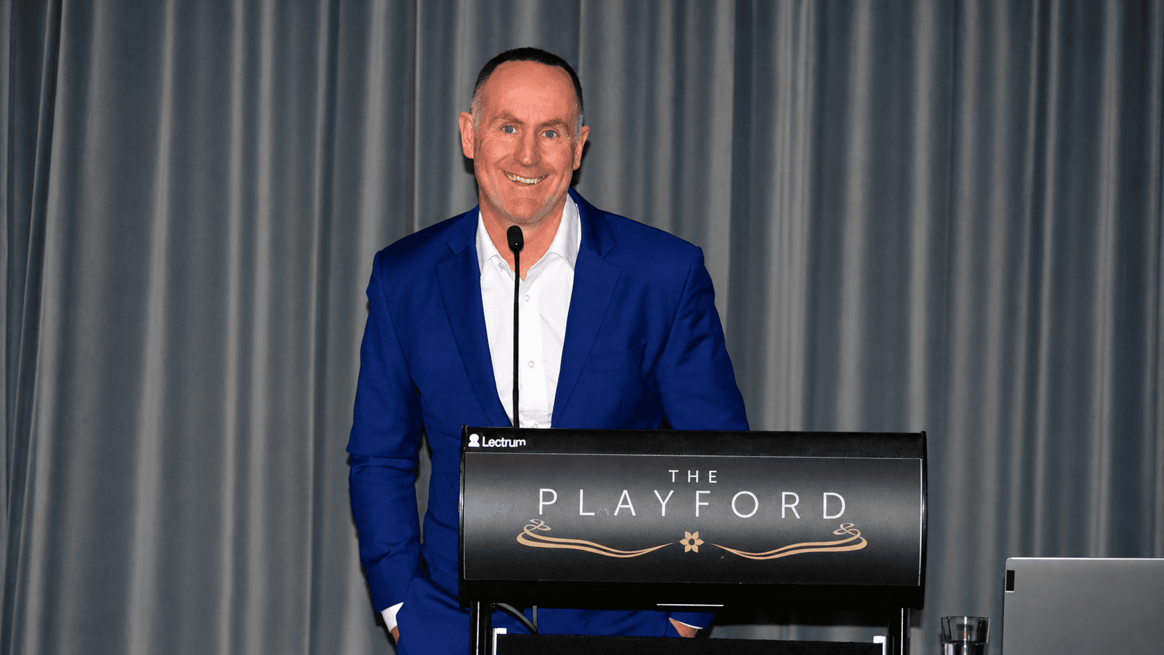 Bevan Jones smiling at the lectern at The Playford